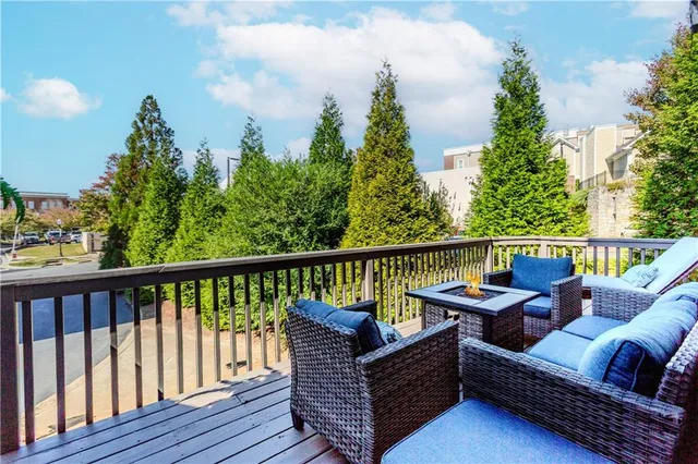 a outdoor living space with patio furniture and wooden floor