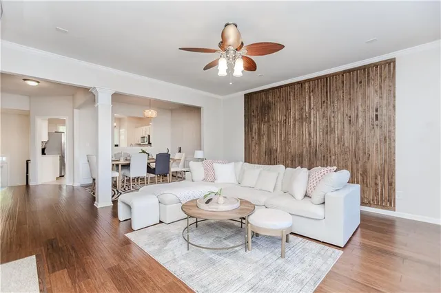 a living room with furniture fireplace and flat screen tv