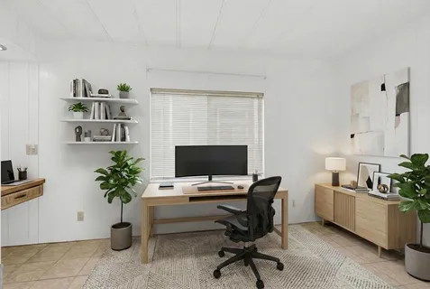 a workspace with furniture and a potted plant