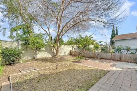 a view of a street with a building in the background
