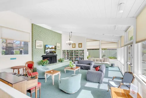 a dining room with furniture window and outside view