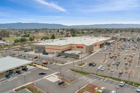 an aerial view of a chairs and table