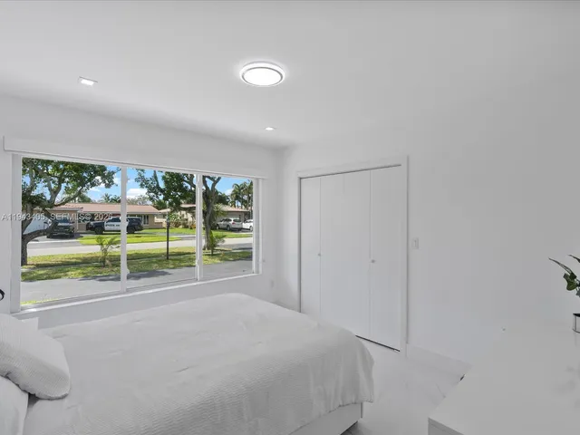 a view of a room with wooden floor and outer view