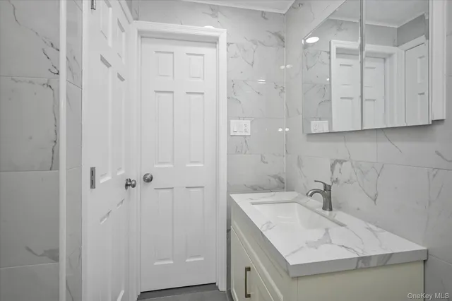 a bathroom with a sink and a shower