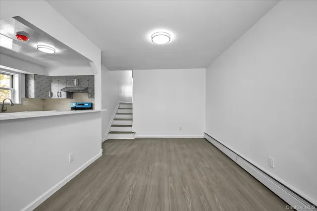 a kitchen with granite countertop a sink and a stove top oven