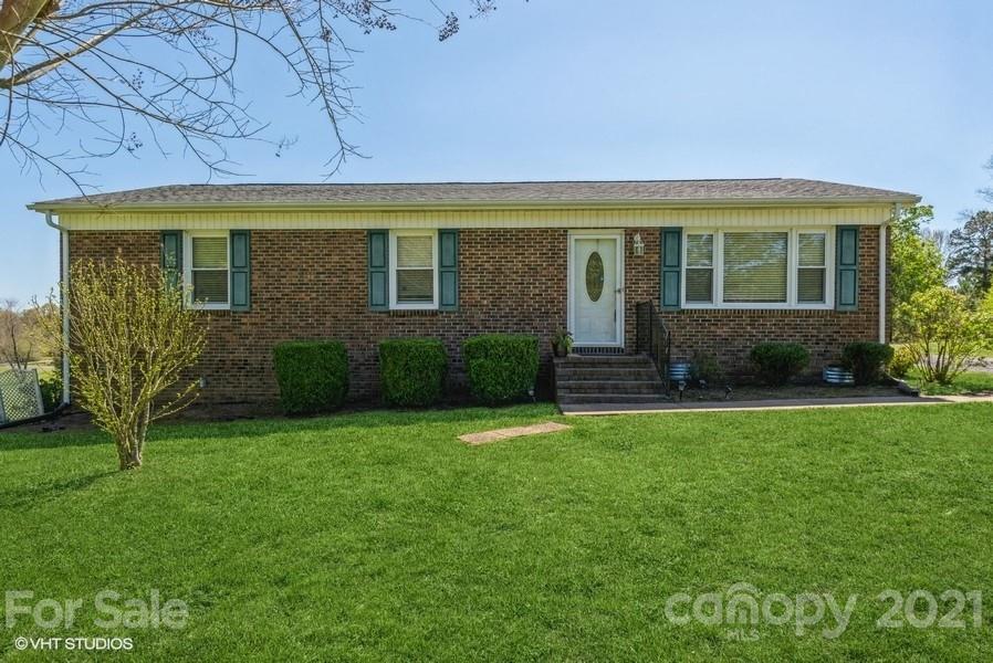2564 Stroupe Road Clover, SC 29710 - Photo 1 of 29 a front view of a house with garden