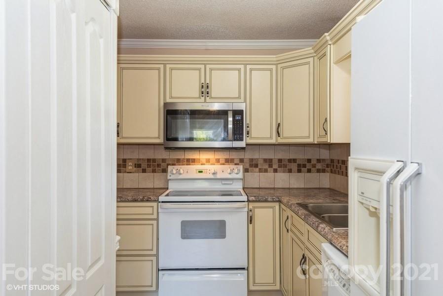 2564 Stroupe Road Clover, SC 29710 - Photo 14 of 29 a kitchen with a stove and a microwave