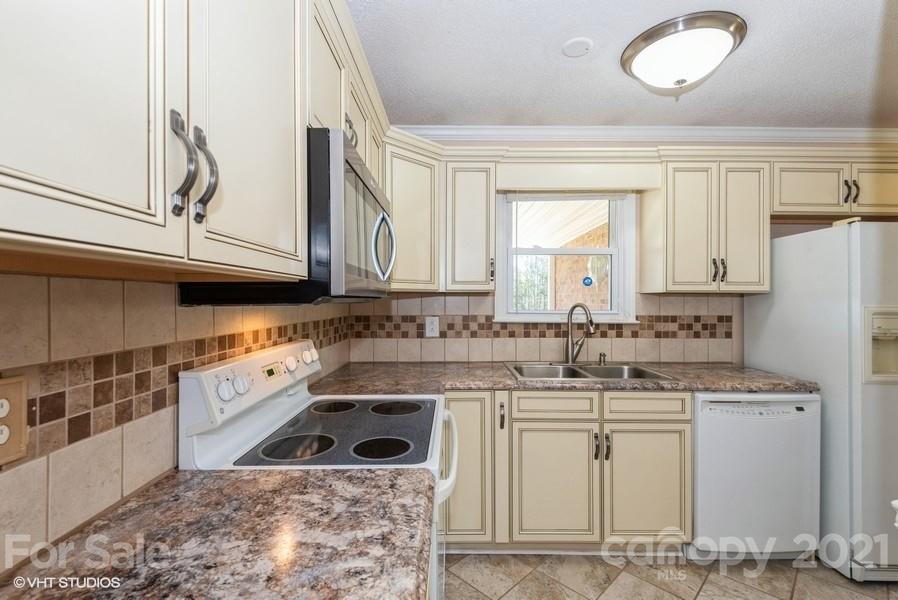 2564 Stroupe Road Clover, SC 29710 - Photo 15 of 29 a kitchen with appliances cabinets and a sink