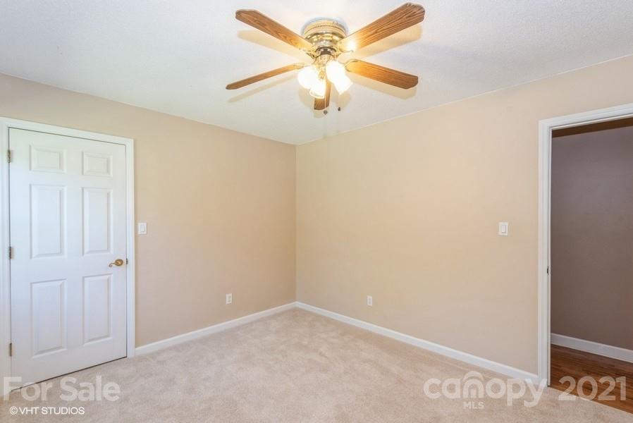2564 Stroupe Road Clover, SC 29710 - Photo 25 of 29 an empty room with windows and fan