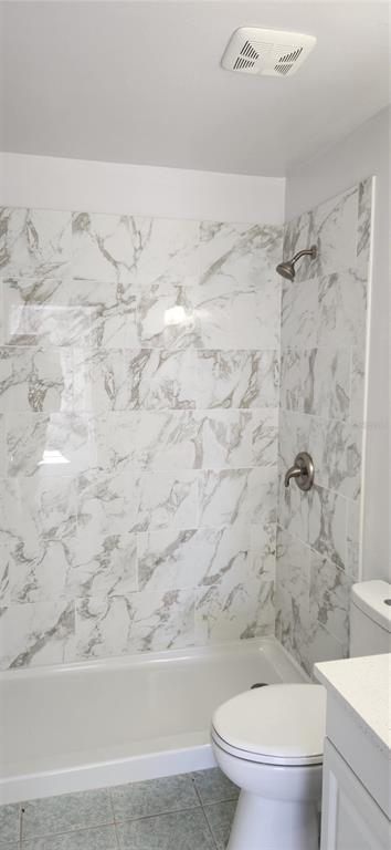 2856 Trenton Lane Deltona, FL 32738 - Photo 13 of 16 a bathroom with a toilet and a shower