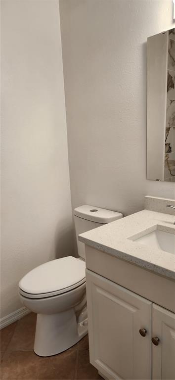 2856 Trenton Lane Deltona, FL 32738 - Photo 14 of 16 a white toilet sitting next to a white sink and vanity