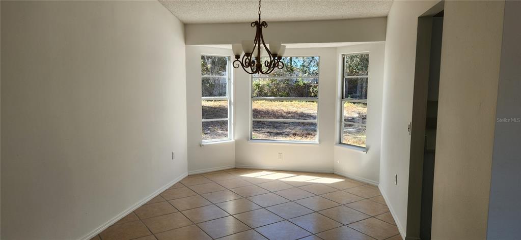 2856 Trenton Lane Deltona, FL 32738 - Photo 5 of 16 a view of an empty room and window