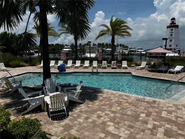 a front view of a house with plants