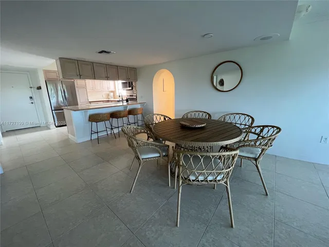 a view of a dining room with furniture and window