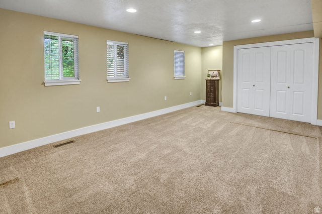 1320 Canyon Park Road Bountiful, UT 84010 - Photo 20 of 28 Unfurnished bedroom featuring light colored carpet, recessed lighting, and a closet