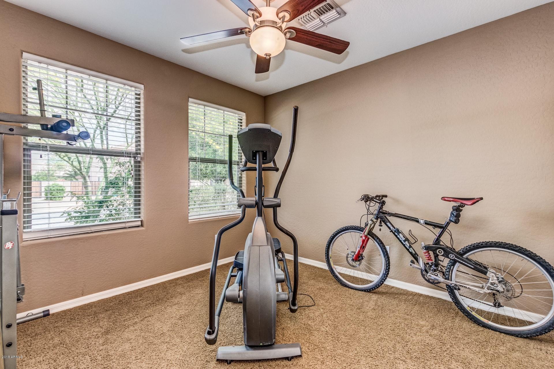 3927 East Blue Sage Road Gilbert, AZ 85297 - Photo 15 of 26 a view of a room with gym equipment
