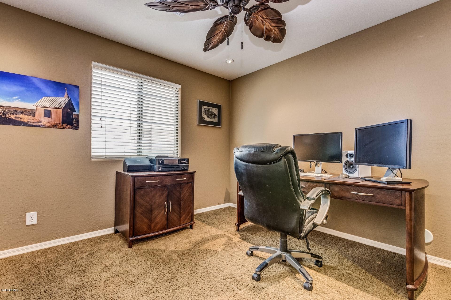 3927 East Blue Sage Road Gilbert, AZ 85297 - Photo 18 of 26 a view of a workspace with furniture