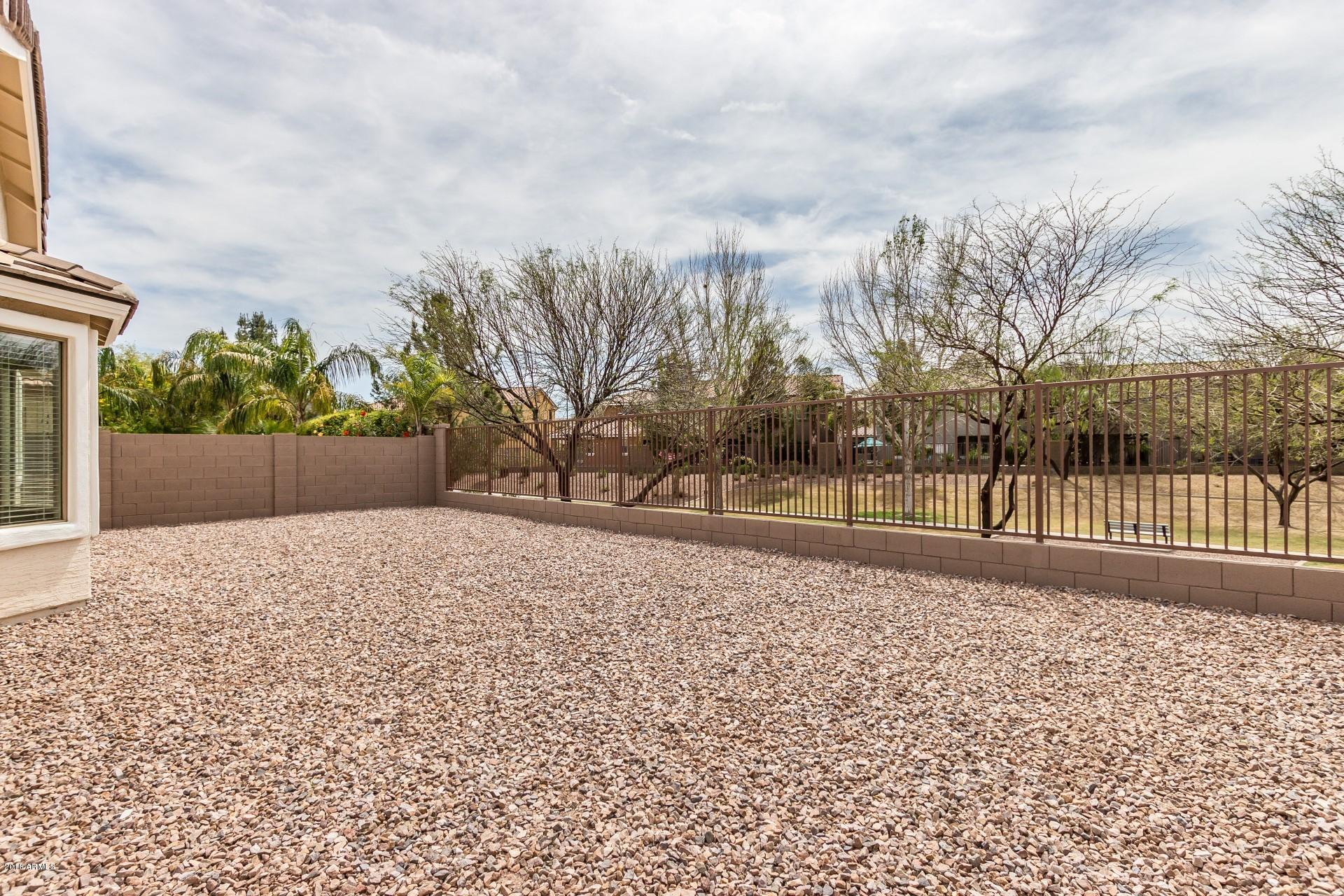 3927 East Blue Sage Road Gilbert, AZ 85297 - Photo 22 of 26 a view of road and trees