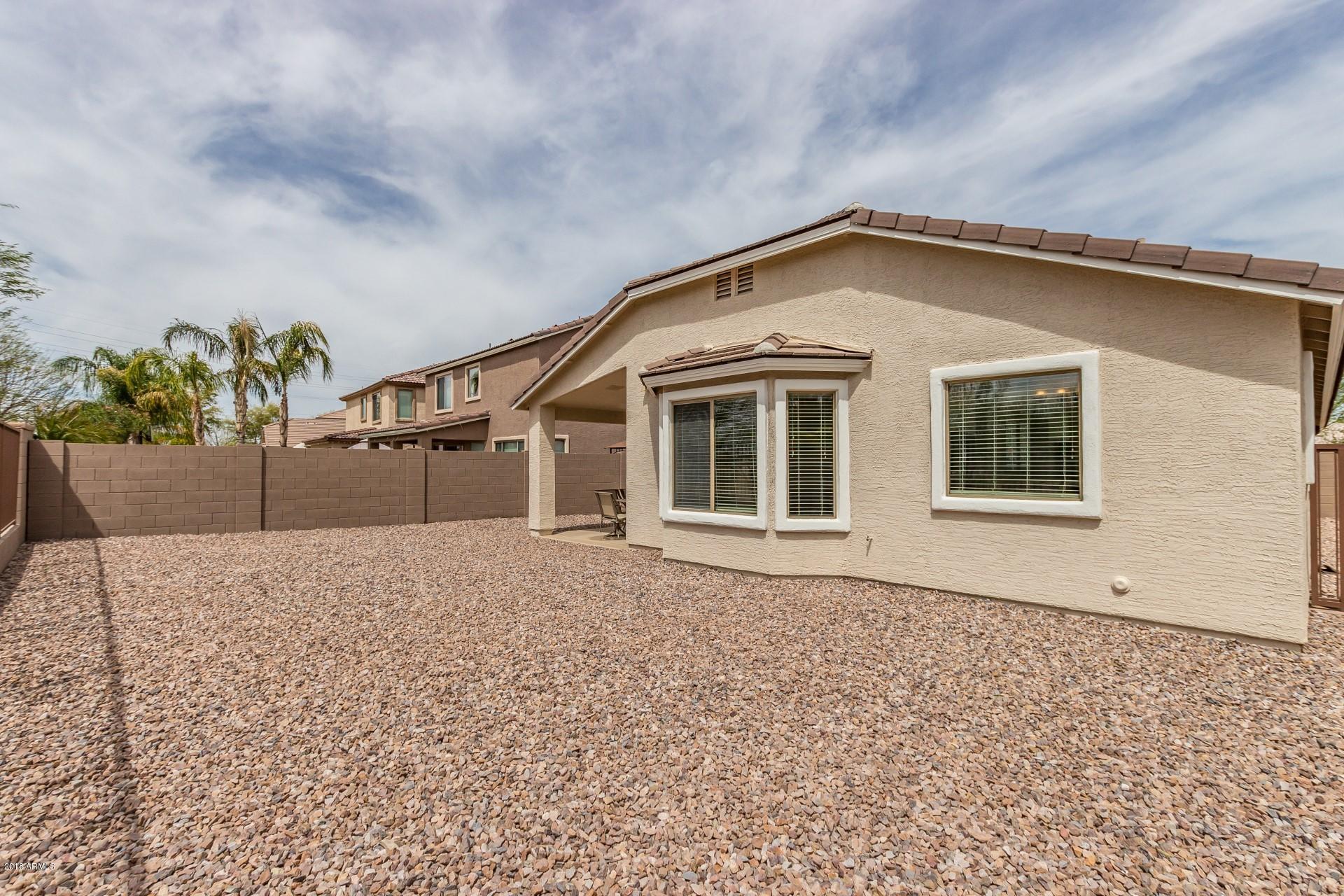 3927 East Blue Sage Road Gilbert, AZ 85297 - Photo 23 of 26 a house with a outdoor space