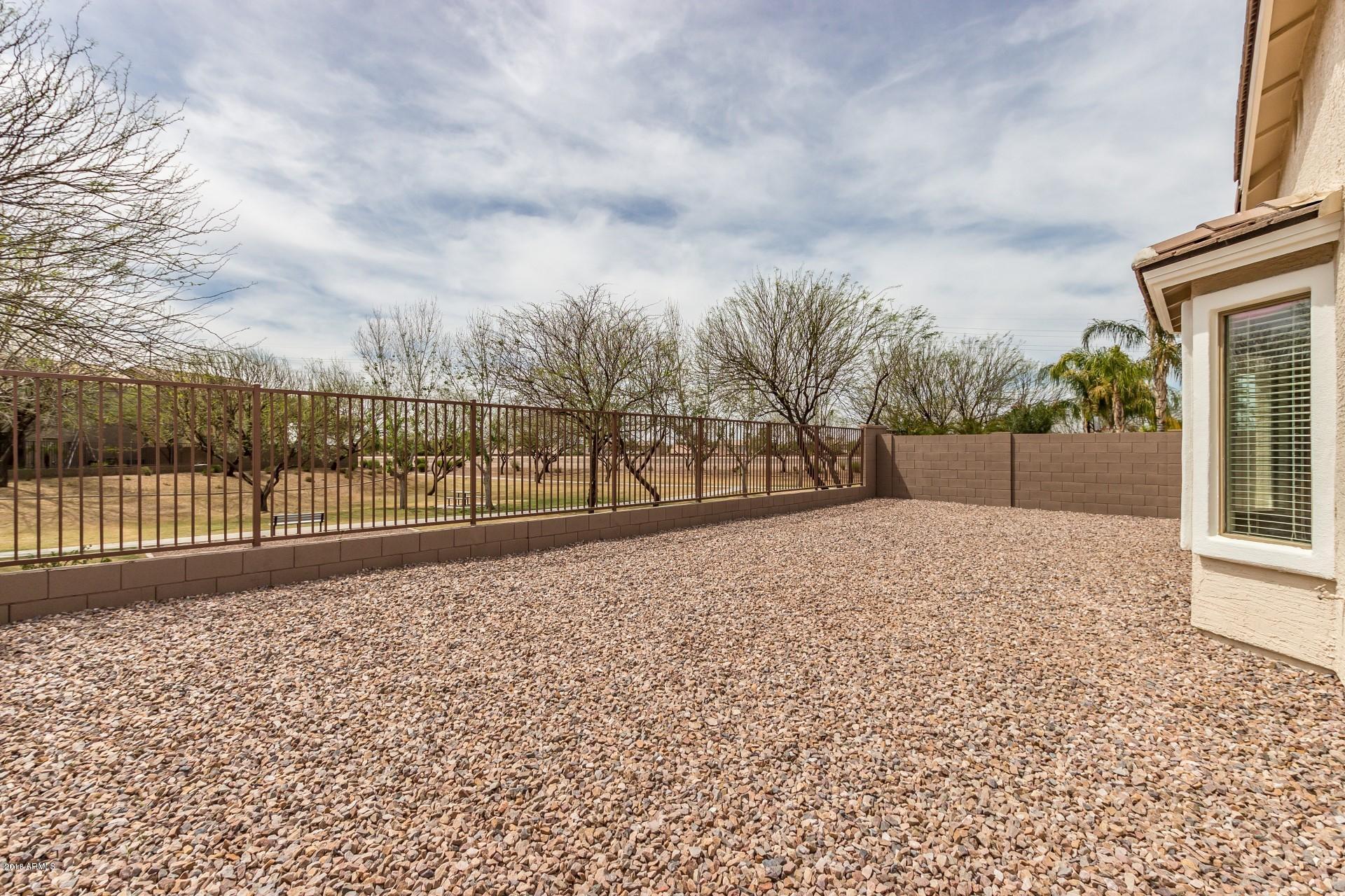 3927 East Blue Sage Road Gilbert, AZ 85297 - Photo 24 of 26 a view of outdoor space with wooden fence