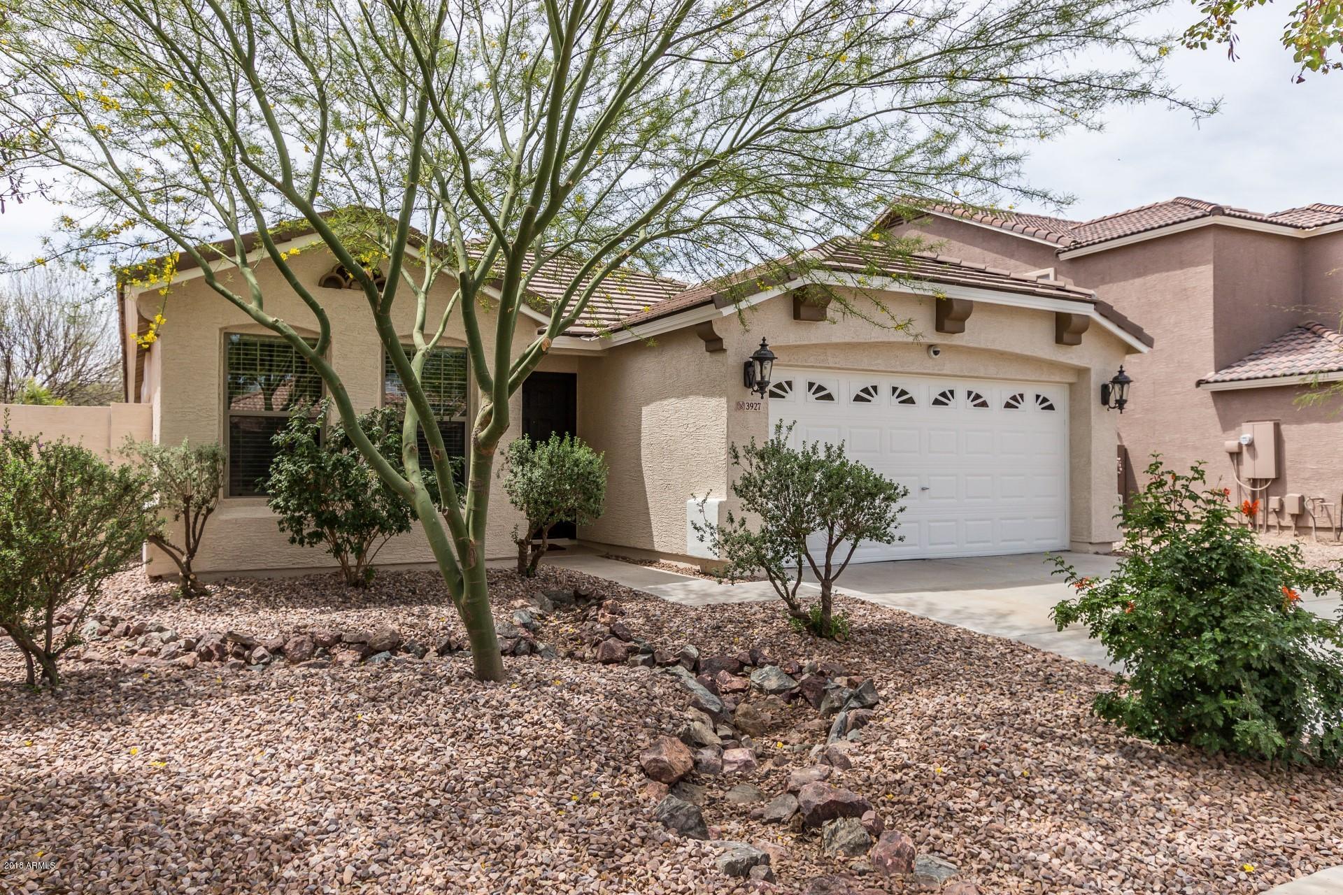 3927 East Blue Sage Road Gilbert, AZ 85297 - Photo 26 of 26 a view of a house with a yard and a tree