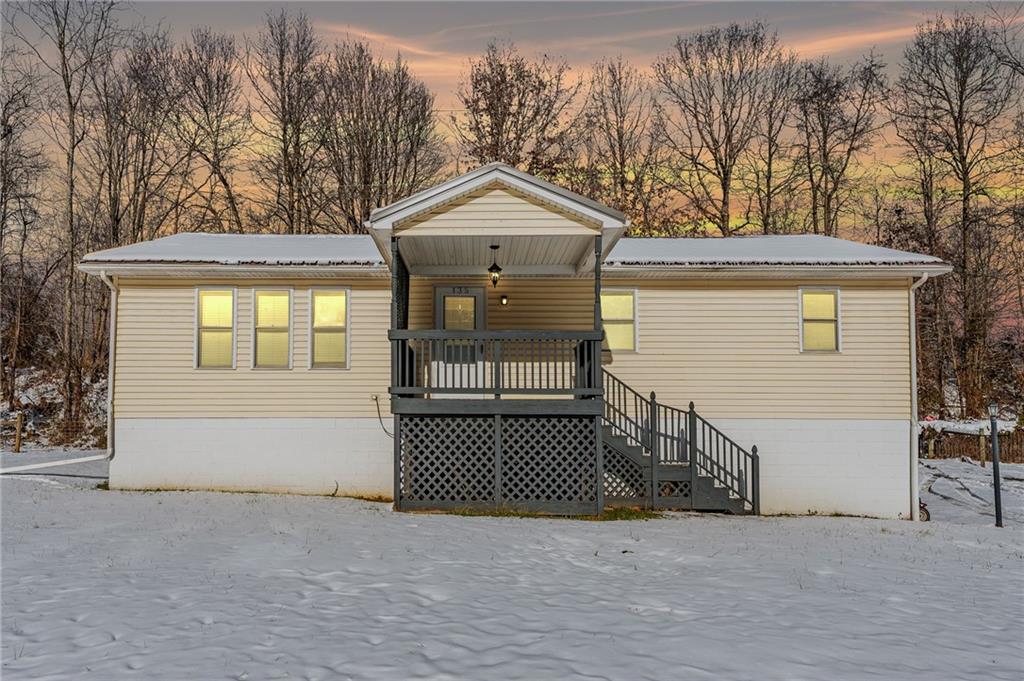 135 Virginia Street Mount Morris, PA 15349 - Photo 2 of 50 a view of a house with a yard and garage