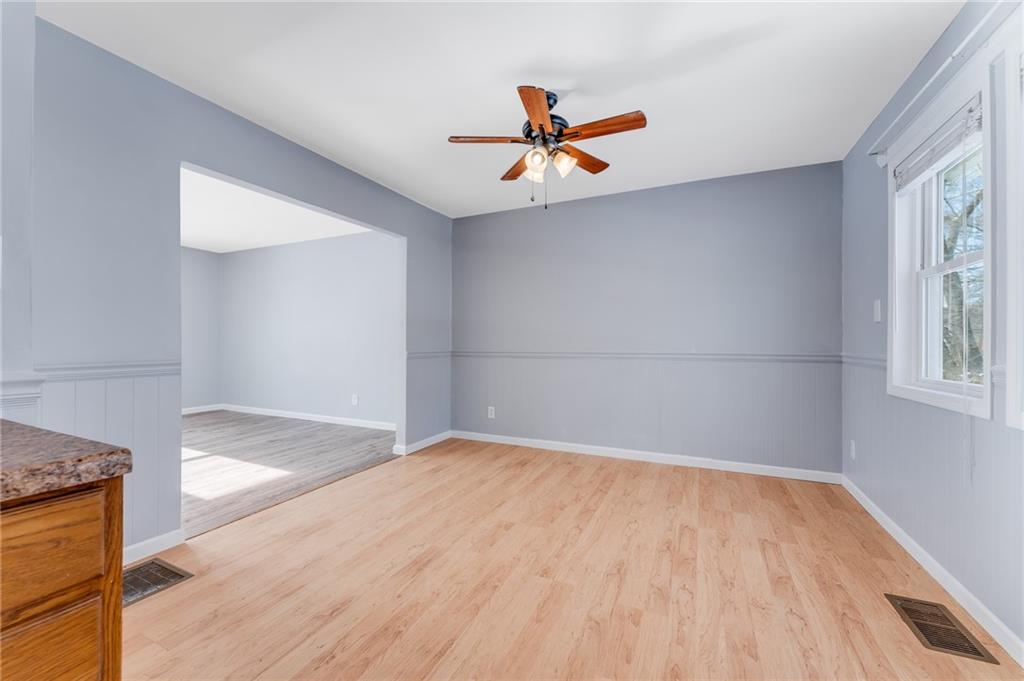 135 Virginia Street Mount Morris, PA 15349 - Photo 29 of 50 a view of an empty room with wooden floor and a window