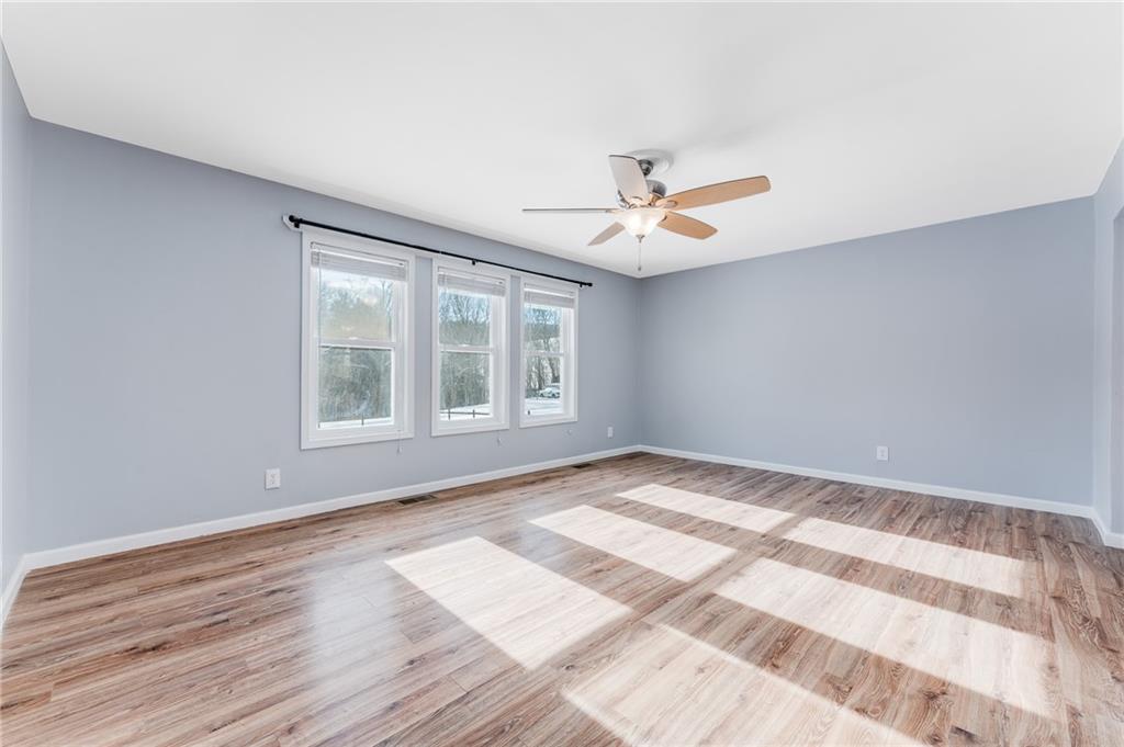 135 Virginia Street Mount Morris, PA 15349 - Photo 33 of 50 a view of empty room with wooden floor and fan