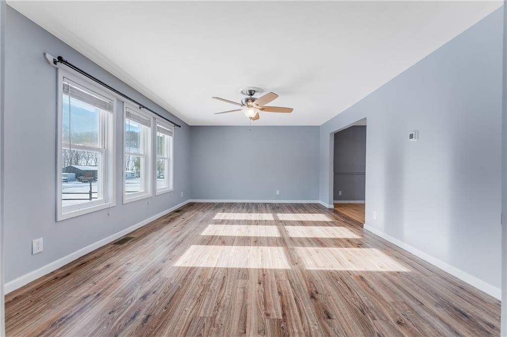 135 Virginia Street Mount Morris, PA 15349 - Photo 34 of 50 wooden floor in an empty room with a window