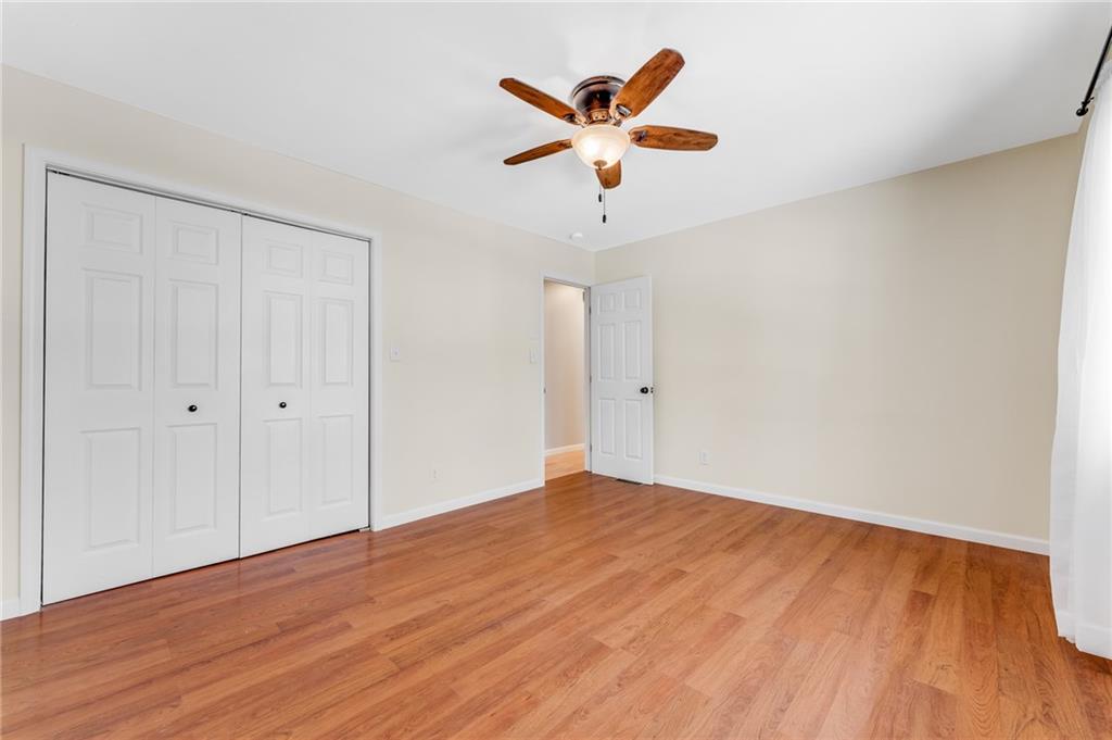 135 Virginia Street Mount Morris, PA 15349 - Photo 40 of 50 an empty room with wooden floor and windows