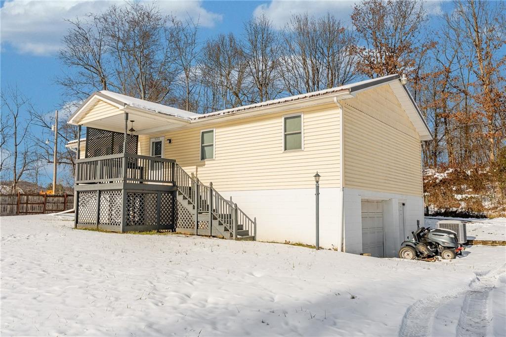 135 Virginia Street Mount Morris, PA 15349 - Photo 4 of 50 a view of a house with a snow in the yard