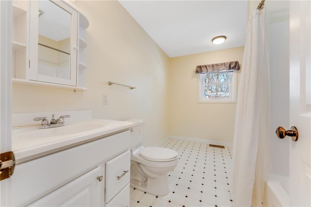 135 Virginia Street Mount Morris, PA 15349 - Photo 41 of 50 a bathroom with a sink a toilet and a mirror
