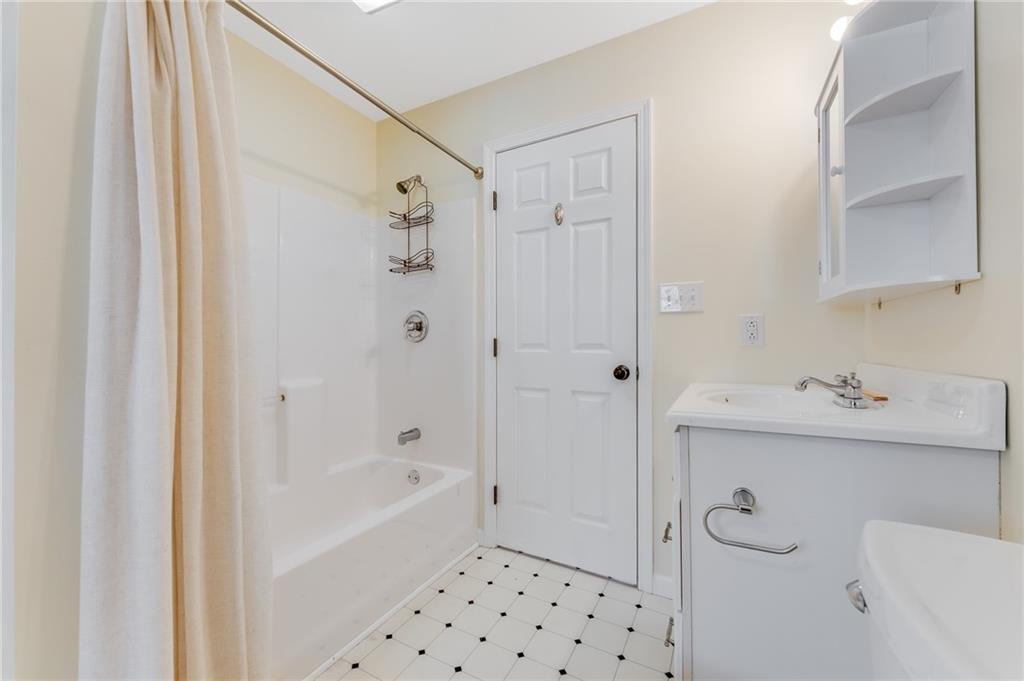 135 Virginia Street Mount Morris, PA 15349 - Photo 43 of 50 a bathroom with a bathtub sink and mirror