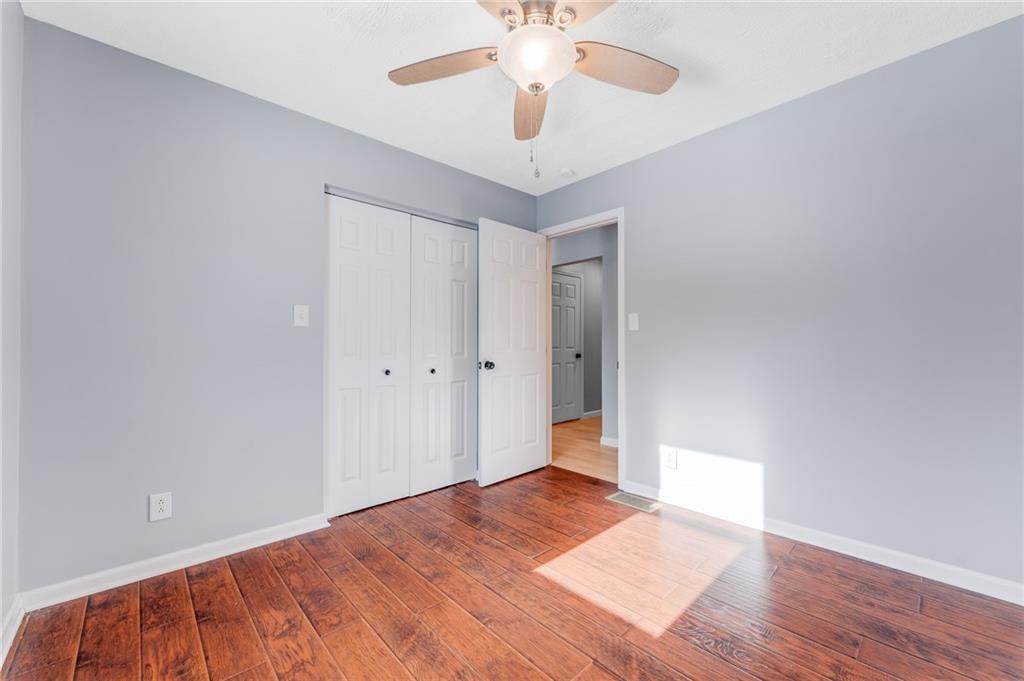 135 Virginia Street Mount Morris, PA 15349 - Photo 45 of 50 a view of a room with wooden floor and a ceiling fan