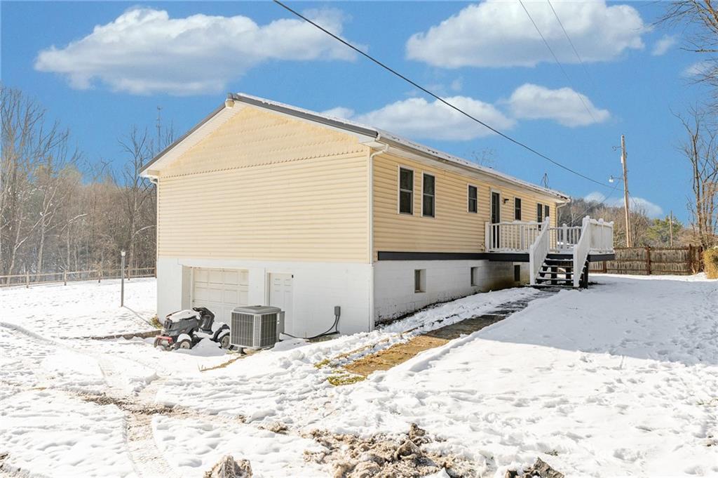 135 Virginia Street Mount Morris, PA 15349 - Photo 7 of 50 a view of a house with snow on the road
