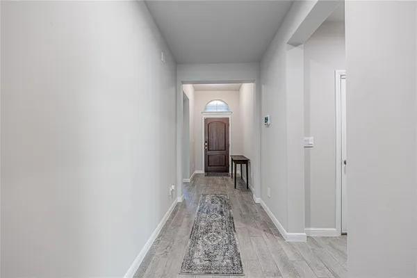 a view of a room with a hallway