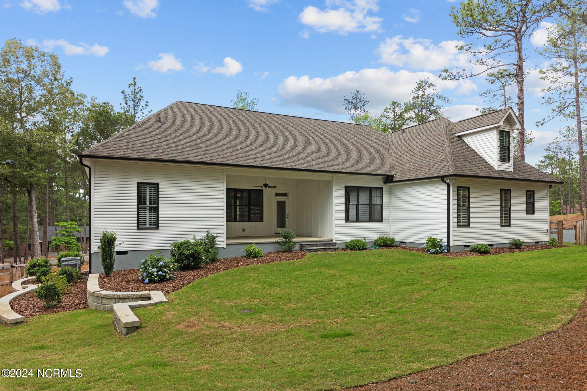 2 Buckhorn Road Jackson Springs, NC 27281 - Photo 47 of 56 Back of home. Hardscapes & professional landscaping