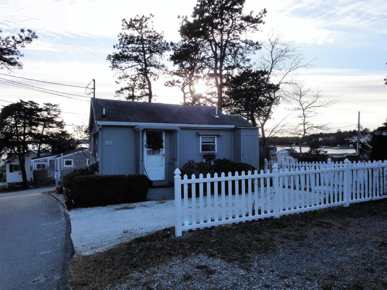 20 Knollview Road, Unit 20B Buzzards Bay, MA 02532 - Photo 1 of 25 a front view of a house with garden