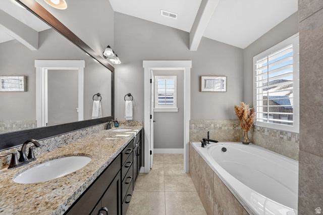 14714 South Bright Wood Road Herriman, UT 84096 - Photo 22 of 41 Primary en-suite Bathroom with double vanity, a bath, and light tile patterned floors