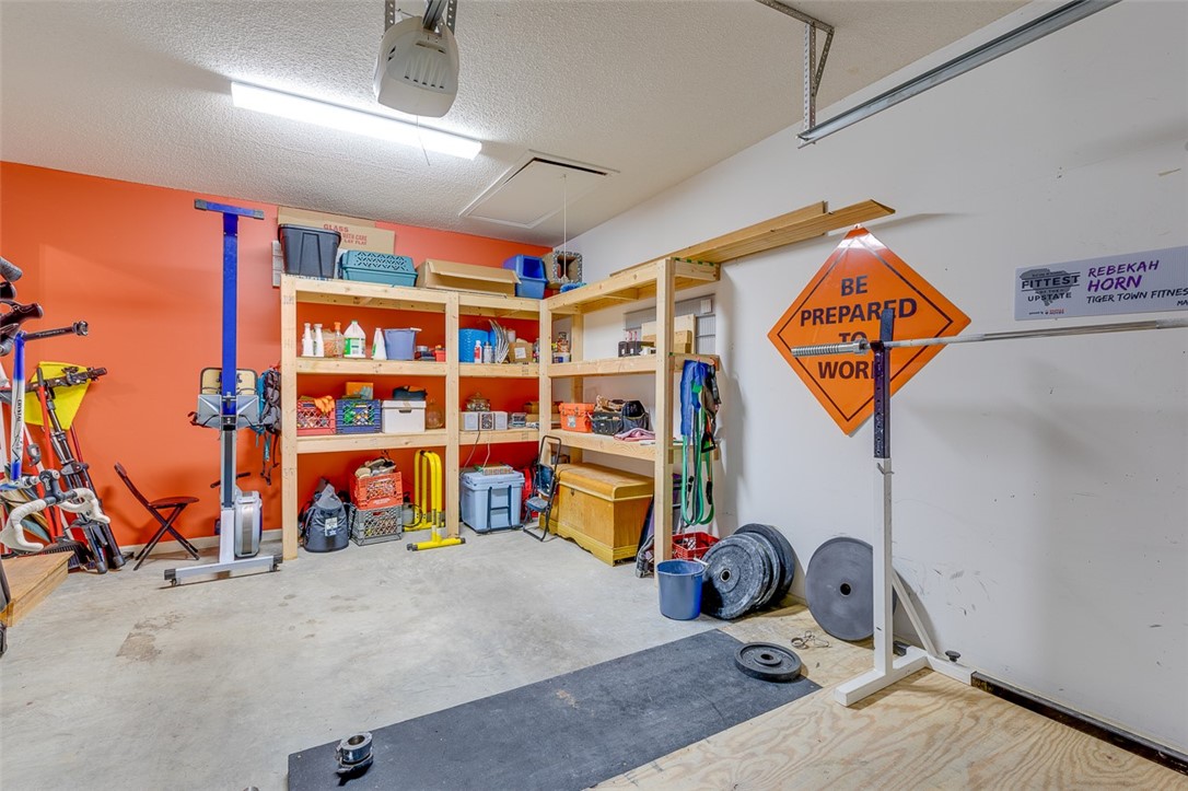 2163 Shea Lane Seneca, SC 29672 - Photo 31 of 31 Garage with built-in shelving for storage as well
