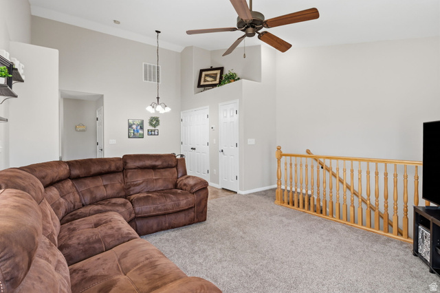 482 South 2500th West, Unit 2 Springville, UT 84663 - Photo 8 of 52 Vaulted ceilings with crown molding, ceiling fan, and carpeted flooring