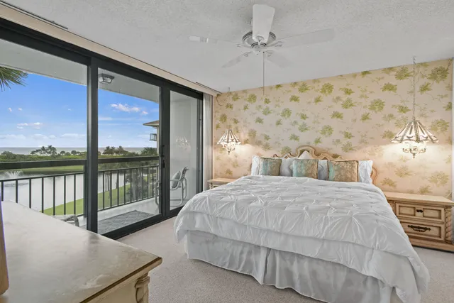 a spacious bedroom with a bed and a large window