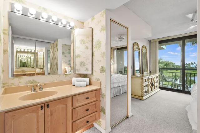 a bathroom with a sink double vanity and a mirror