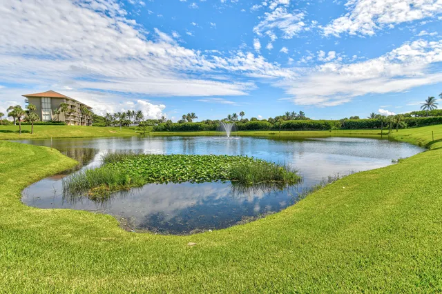 a view of a patio with dining table and chairs