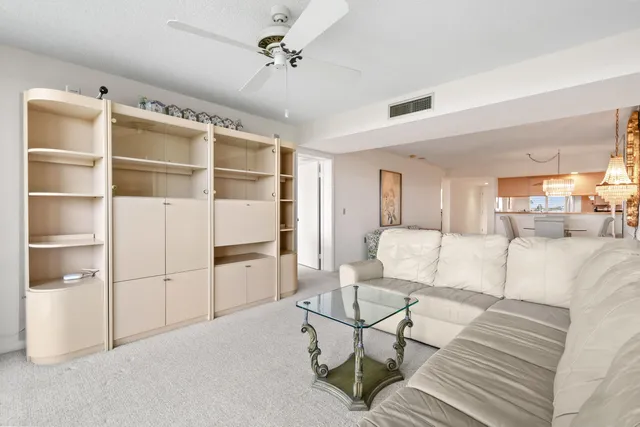 a kitchen with granite countertop a sink stove and refrigerator