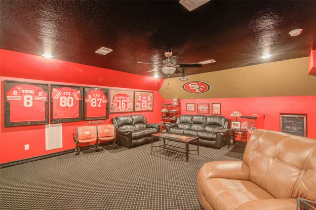 a living room with furniture a rug and a chandelier