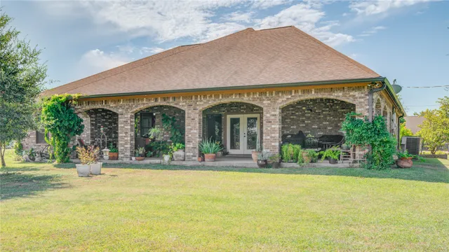 a view of a house with garden and plants