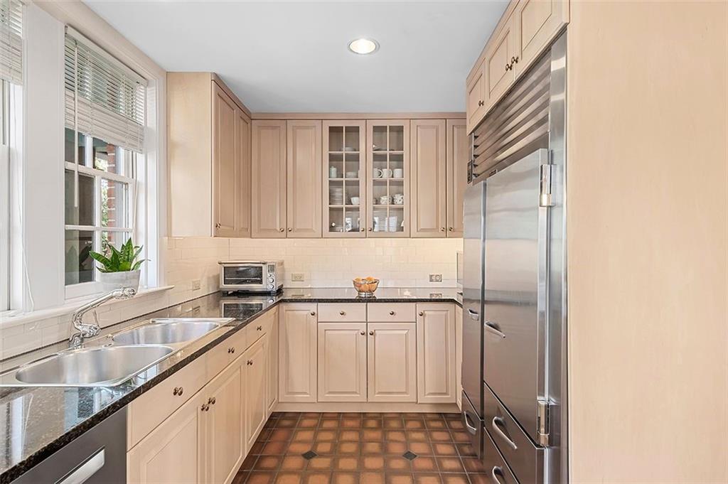1342 Inverness Avenue Pittsburgh, PA 15217 - Photo 11 of 40 a kitchen with a sink a window and cabinets