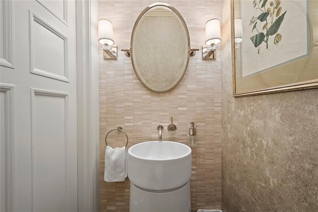 1342 Inverness Avenue Pittsburgh, PA 15217 - Photo 14 of 40 a bathroom with a sink a mirror and a toilet