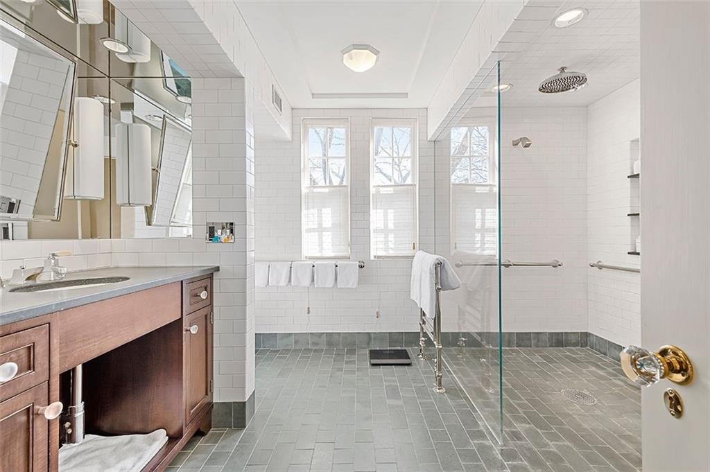 1342 Inverness Avenue Pittsburgh, PA 15217 - Photo 18 of 40 a spacious bathroom with a tub sink shower and a mirror